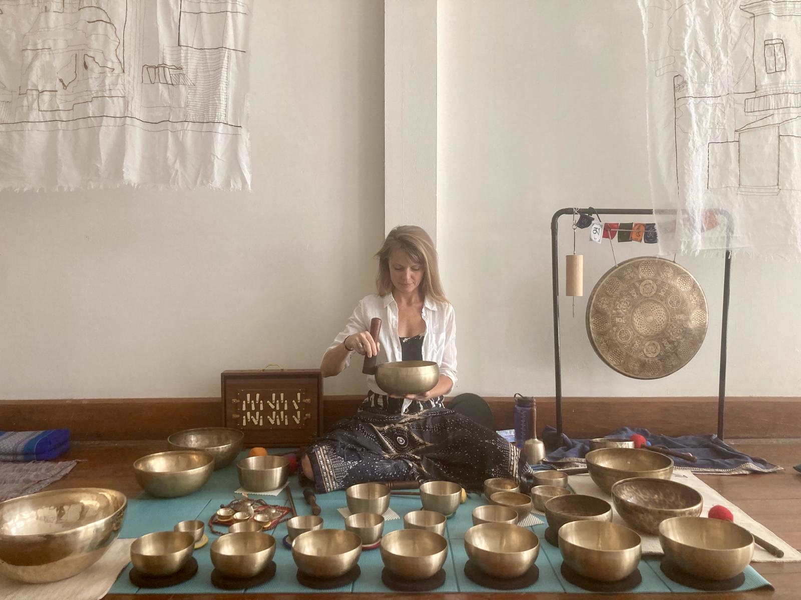 Colleen Thornton, founder of BlackCrow Singing Bowls, with Jambati singing bowls
